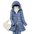 Women's blue lightweight quilted puffer jacket with an insulated fill