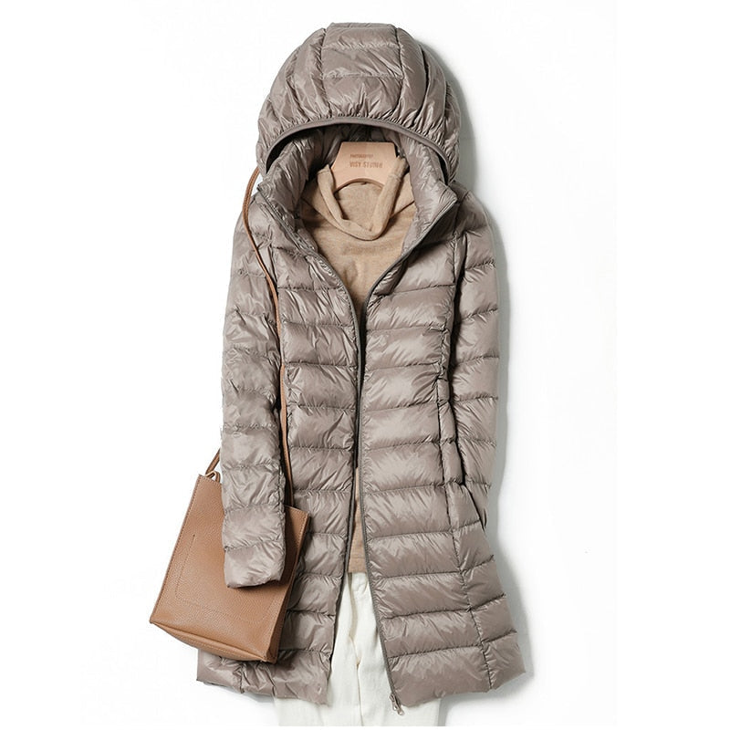 Women's blue lightweight quilted puffer jacket with an insulated fill