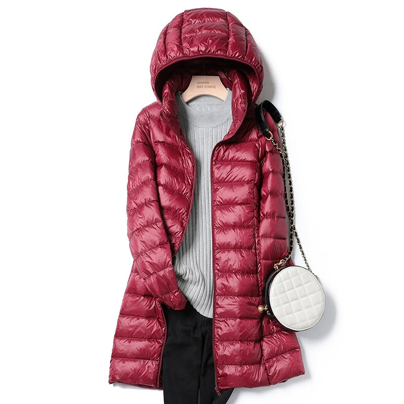 Women's blue lightweight quilted puffer jacket with an insulated fill
