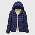 Women's dark blue quilted hooded puffer jacket with a water-resistant finish
