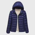 Women's dark blue quilted hooded puffer jacket with a water-resistant finish