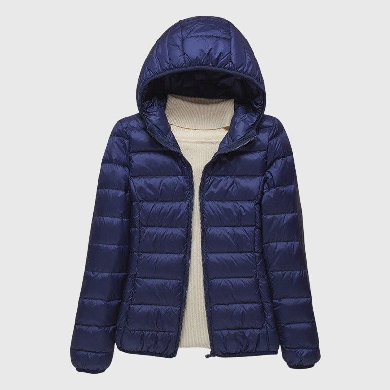 Women's dark blue quilted hooded puffer jacket with a water-resistant finish