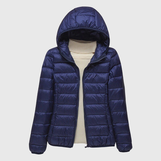 Women's dark blue quilted hooded puffer jacket with a water-resistant finish