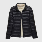 Women's black quilted hooded puffer jacket with a water-resistant finish