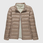 Women's black quilted hooded puffer jacket with a water-resistant finish