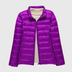 Women's turquoise quilted hooded puffer jacket with a water-resistant finish