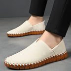 Hand-stitched leather loafers with a slip-on design, product still life