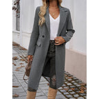 Tailored long coat with a notch lapel and front button fastening, product still life