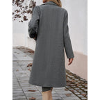 Tailored long coat with a notch lapel and front button fastening, product still life