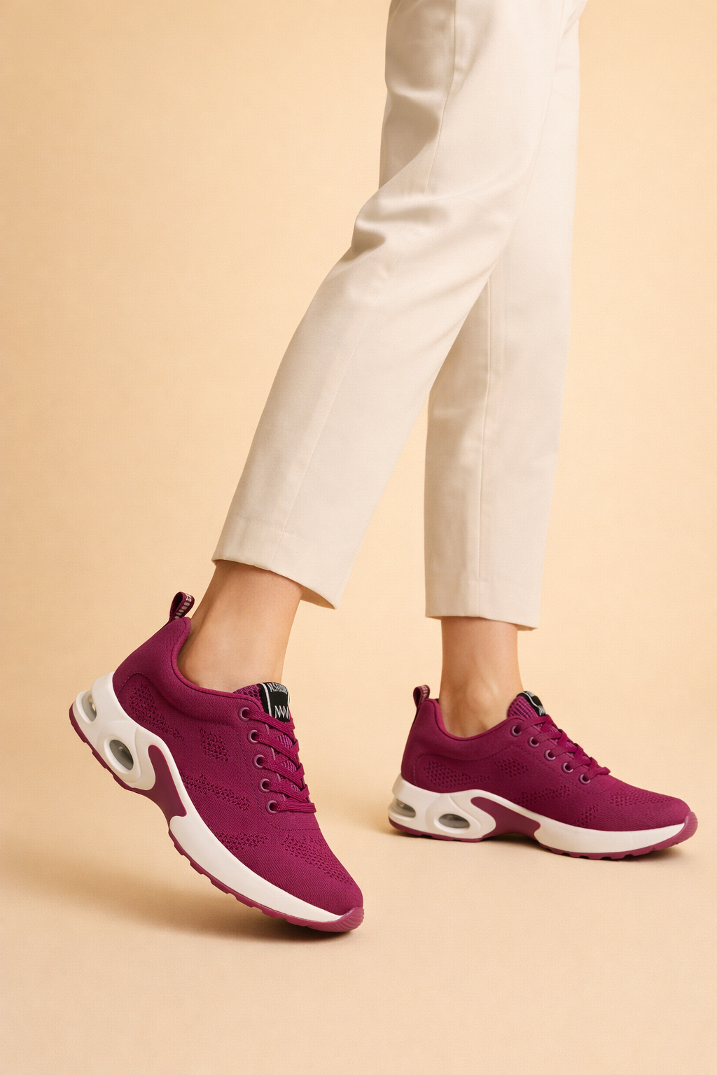 Women's black lightweight sports trainers with a breathable knit upper