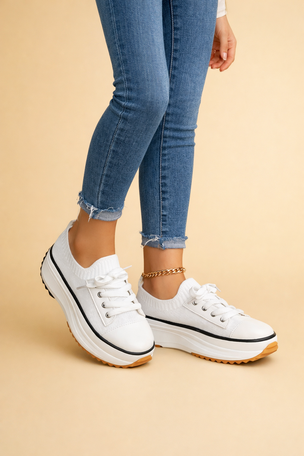 Women's white platform knit trainers with a lace-up front