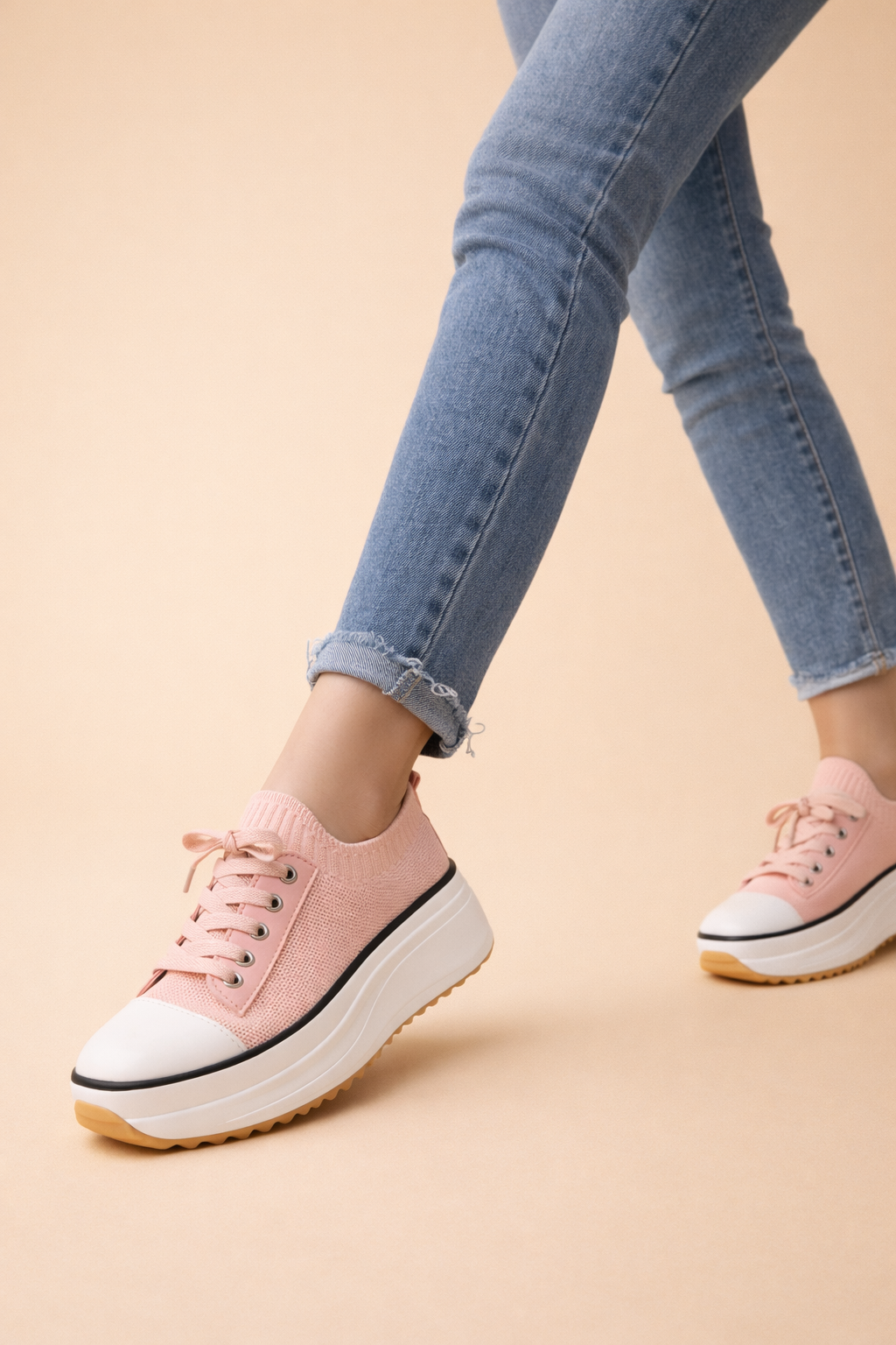 Women's white platform knit trainers with a lace-up front