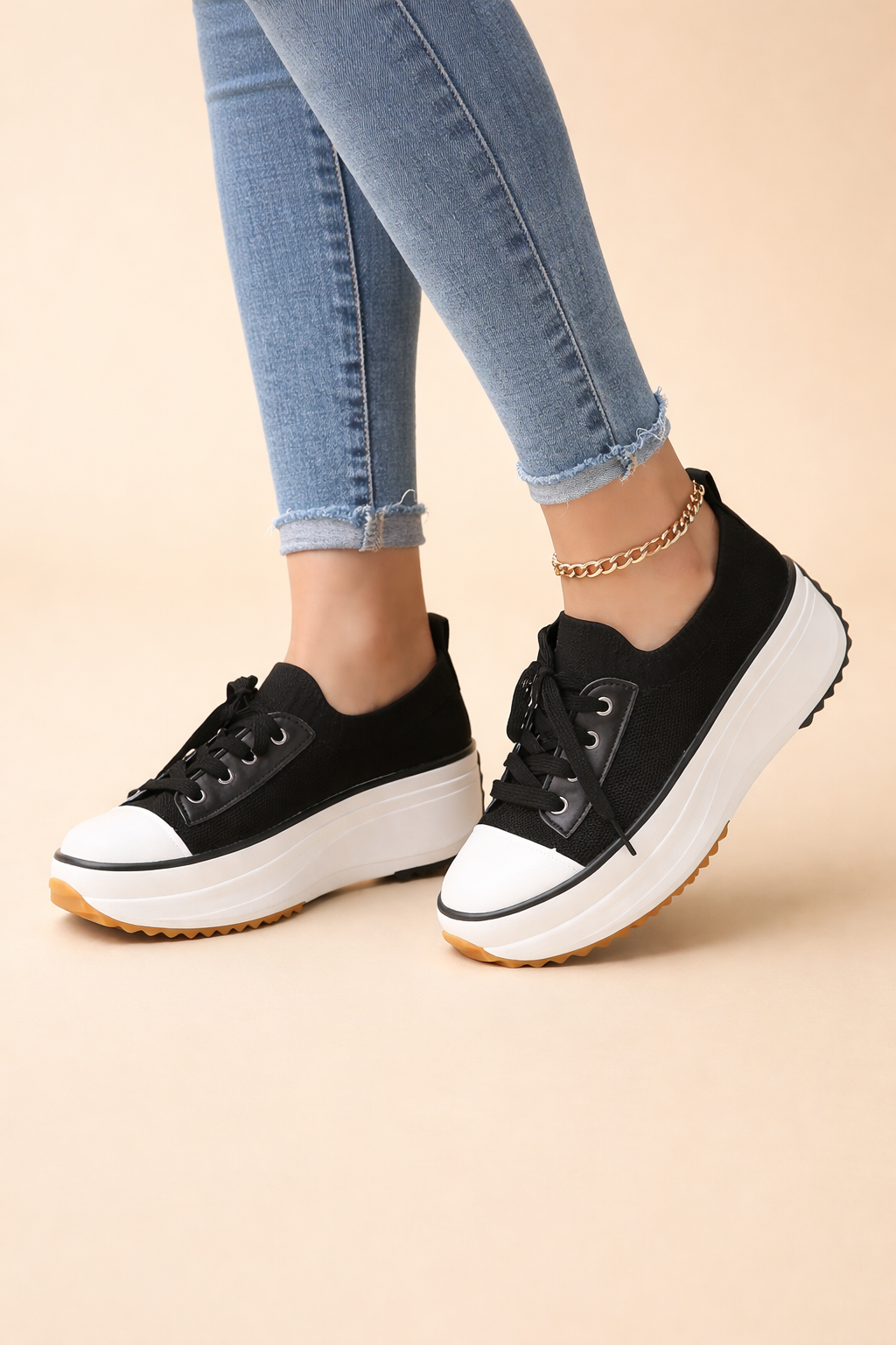 Women's white platform knit trainers with a lace-up front