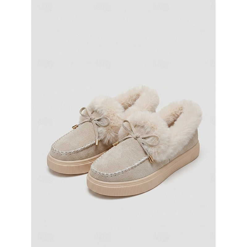 Fur-lined moccasin slippers, close-up of faux fur trim