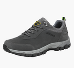 Grey men's waterproof hiking shoes with a grip outsole for autumn trails