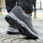Grey men's waterproof hiking shoes with a grip outsole for autumn trails