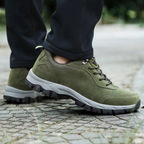 Grey men's waterproof hiking shoes with a grip outsole for autumn trails