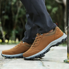 Grey men's waterproof hiking shoes with a grip outsole for autumn trails