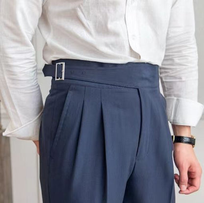 Men's black pleated trousers with a high waist and adjustable tabs