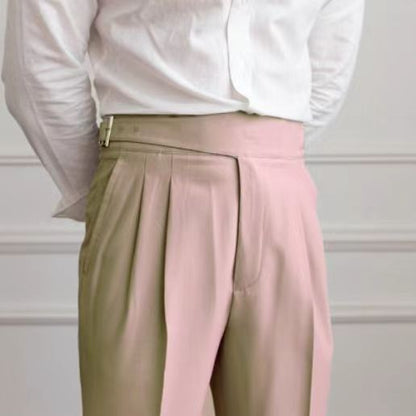 Men's navy blue pleated trousers with a high waist and adjustable tabs