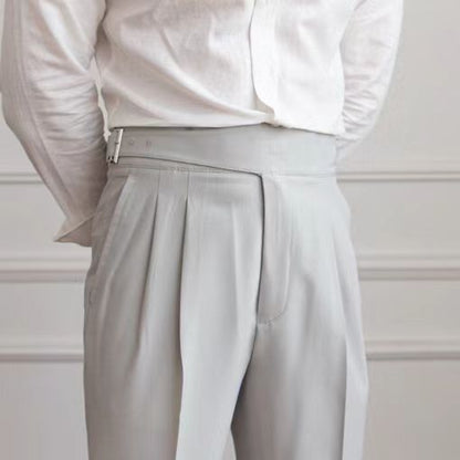 Men's navy blue pleated trousers with a high waist and adjustable tabs