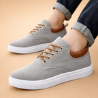 Brown men's canvas trainers with a breathable lace-up design
