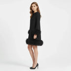 Women's mini dress with a faux fur hem and long sleeves, front view