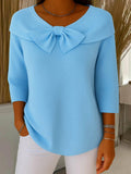 Women's blue bow detail knit jumper with a soft, feminine finish