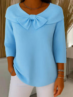Women's blue bow detail knit jumper with a soft, feminine finish