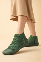 Women's brown low block heel ankle boots with a cushioned interior