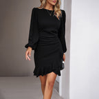 Women's black bodycon wrap dress with a ruffle hem and gathered puff sleeves