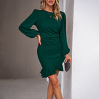 Women's dark green bodycon wrap dress with a ruffle hem and gathered puff sleeves