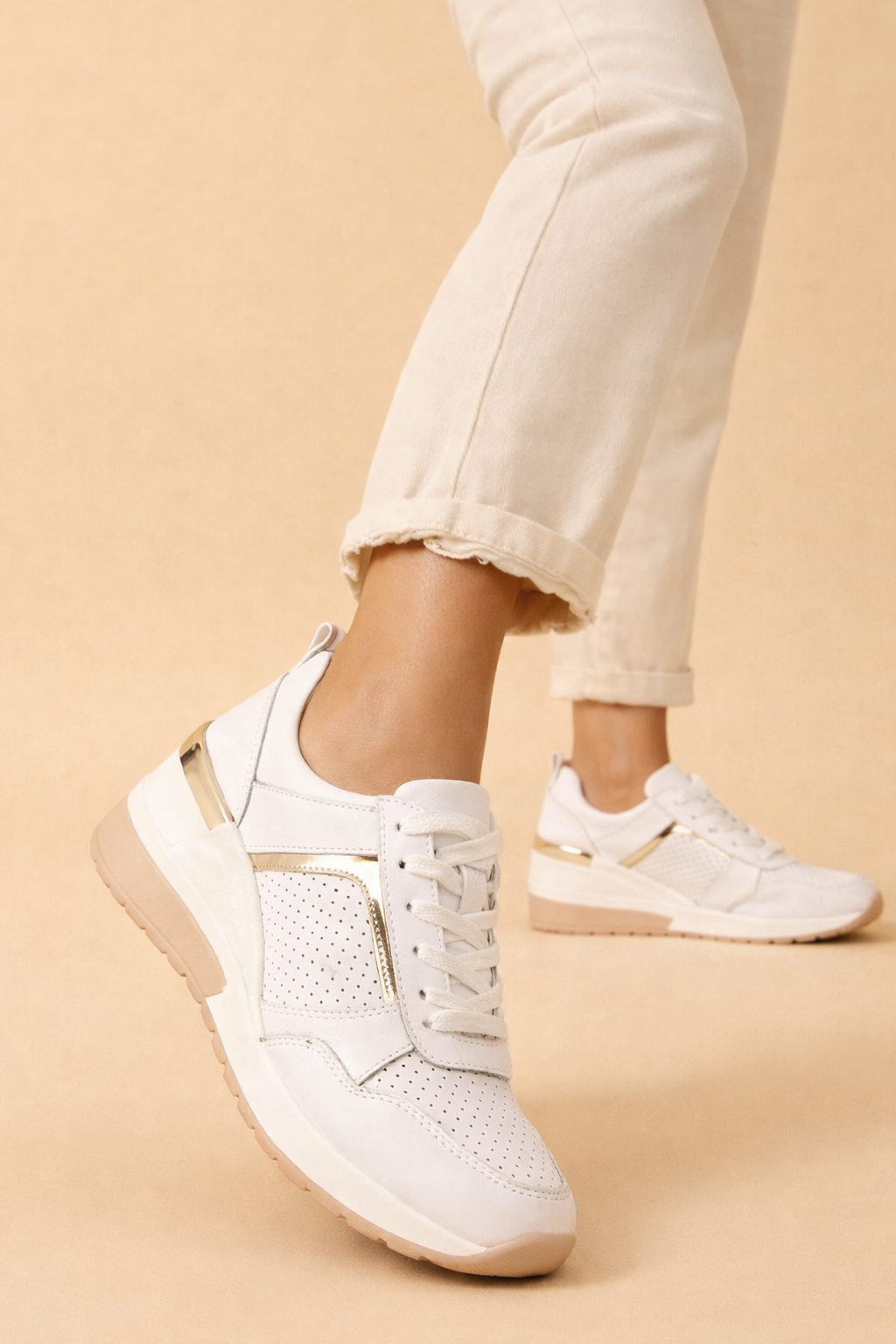 Women's white hidden wedge trainers with a breathable upper