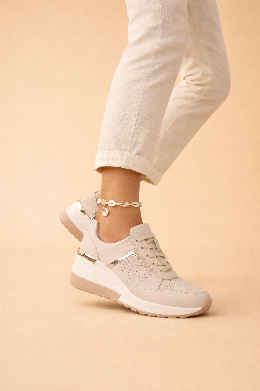 Women's white hidden wedge trainers with a breathable upper