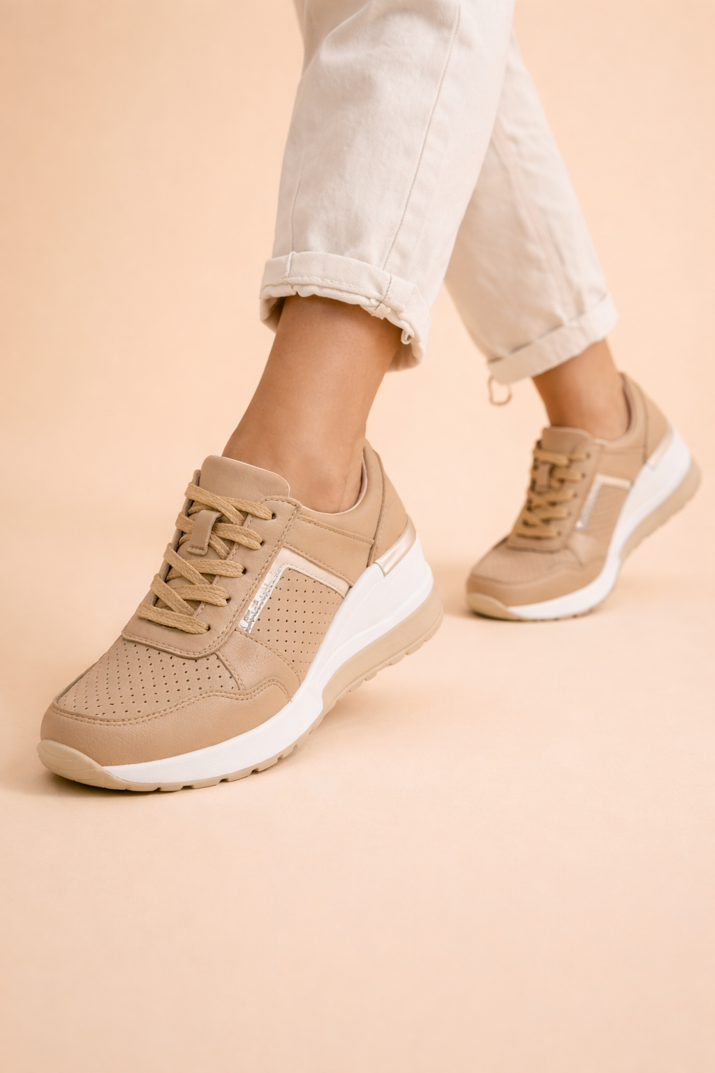 Women's white hidden wedge trainers with a breathable upper