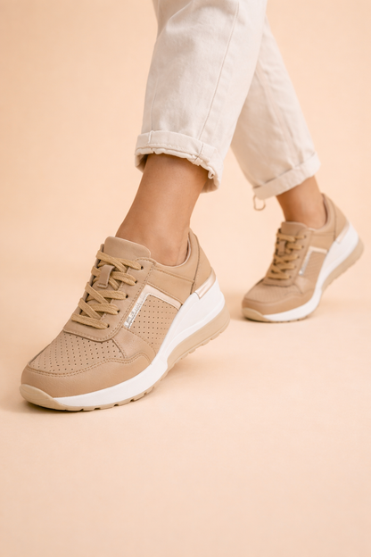 Women's white hidden wedge trainers with a breathable upper