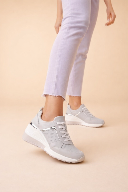 Women's white hidden wedge trainers with a breathable upper