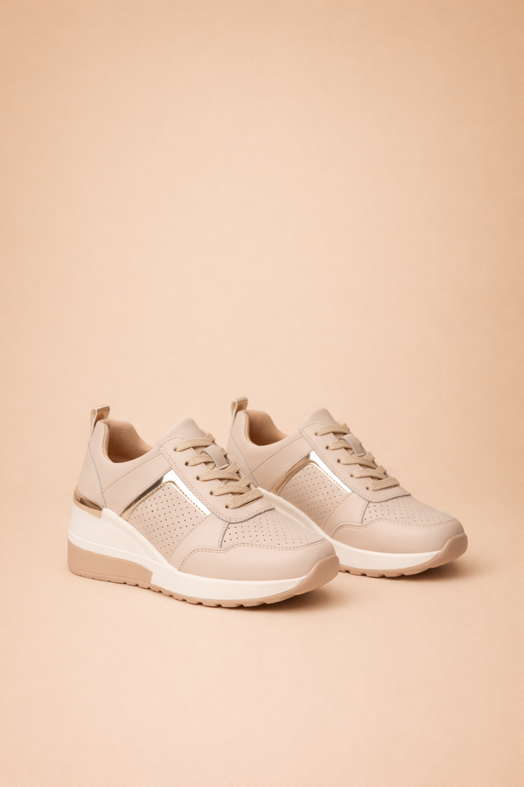 Women's white hidden wedge trainers with a breathable upper