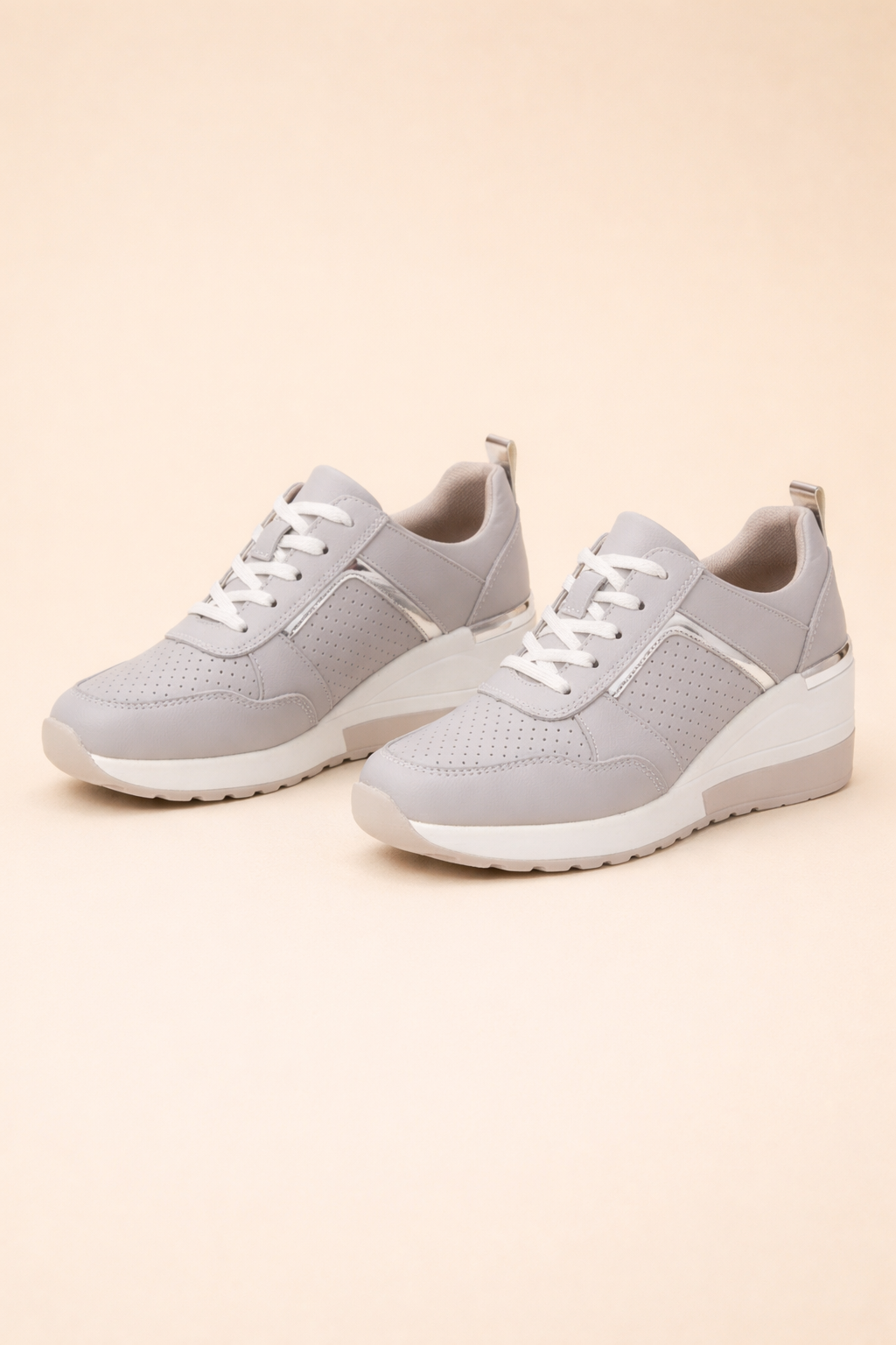 Women's white hidden wedge trainers with a breathable upper