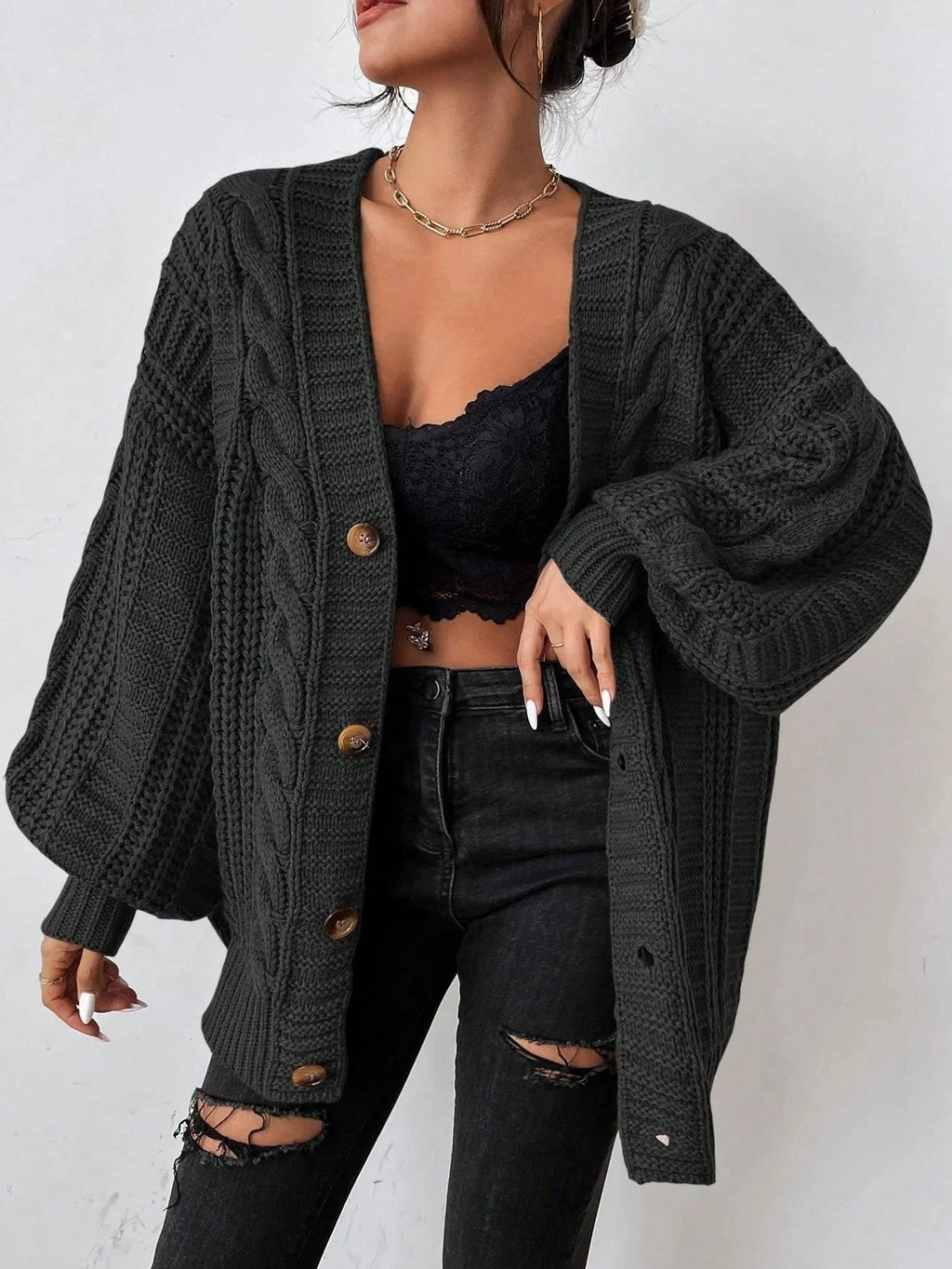 Women's black chunky cable knit balloon sleeve cardigan