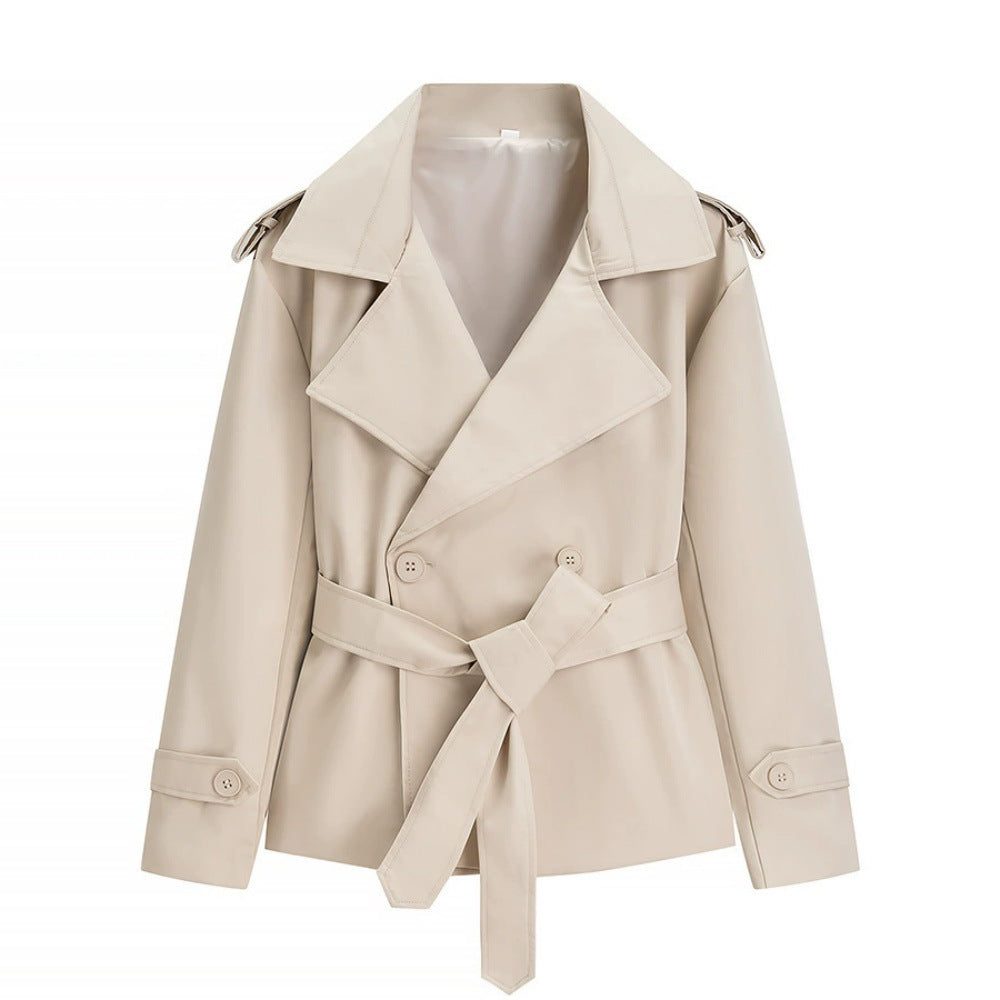 Oversized short trench coat with tie belt, product still life