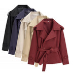 Oversized short trench coat with tie belt, product still life