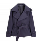 Oversized short trench coat with tie belt, product still life
