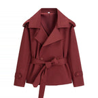 Oversized short trench coat with tie belt, product still life
