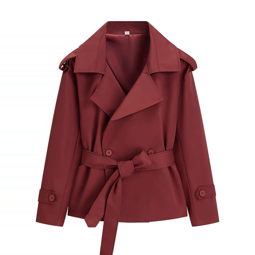 Oversized short trench coat with tie belt, product still life
