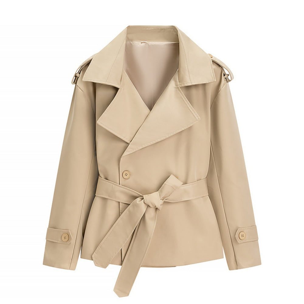 Oversized short trench coat with tie belt, product still life