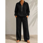 Women's black half zip tracksuit set with wide leg trousers