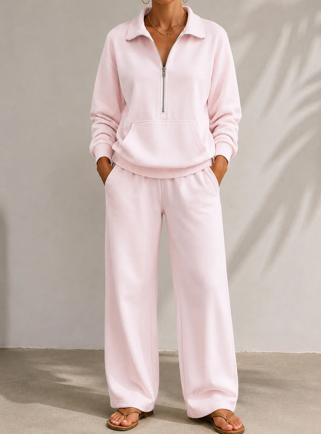 Women's pale pink half zip tracksuit set with wide leg trousers