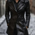 Black tailored mid-length coat with structured shoulders