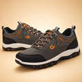 Grey men's all-terrain hiking shoes with a reinforced toe